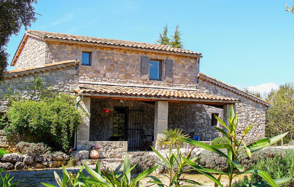 an old stone house in a garden at Stones House in Labeaume
