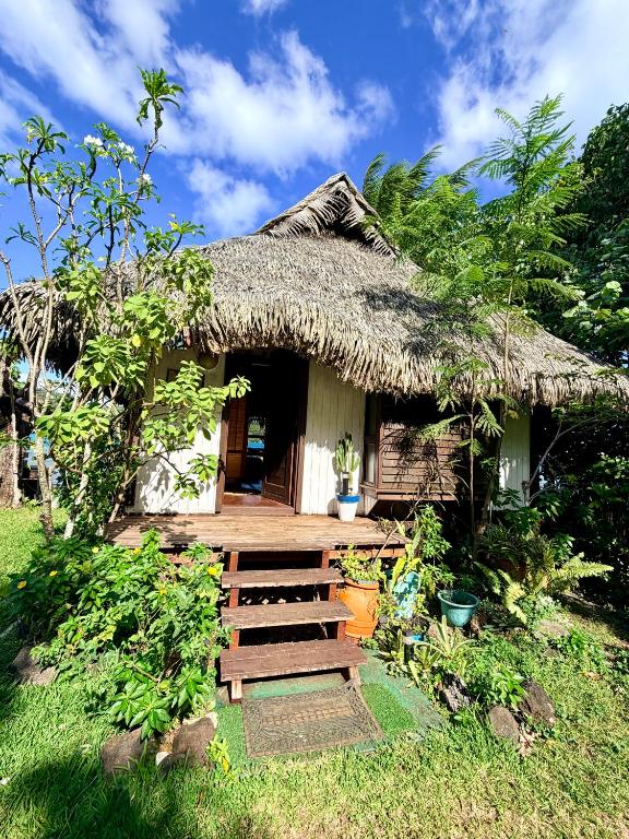 a small hut with a thatched roof at Tiare and Turtle in Bora Bora