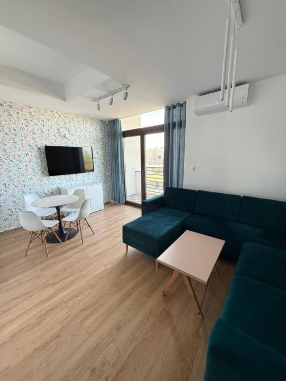 a living room with a couch and a table at Grunwaldzka 62 in Bydgoszcz
