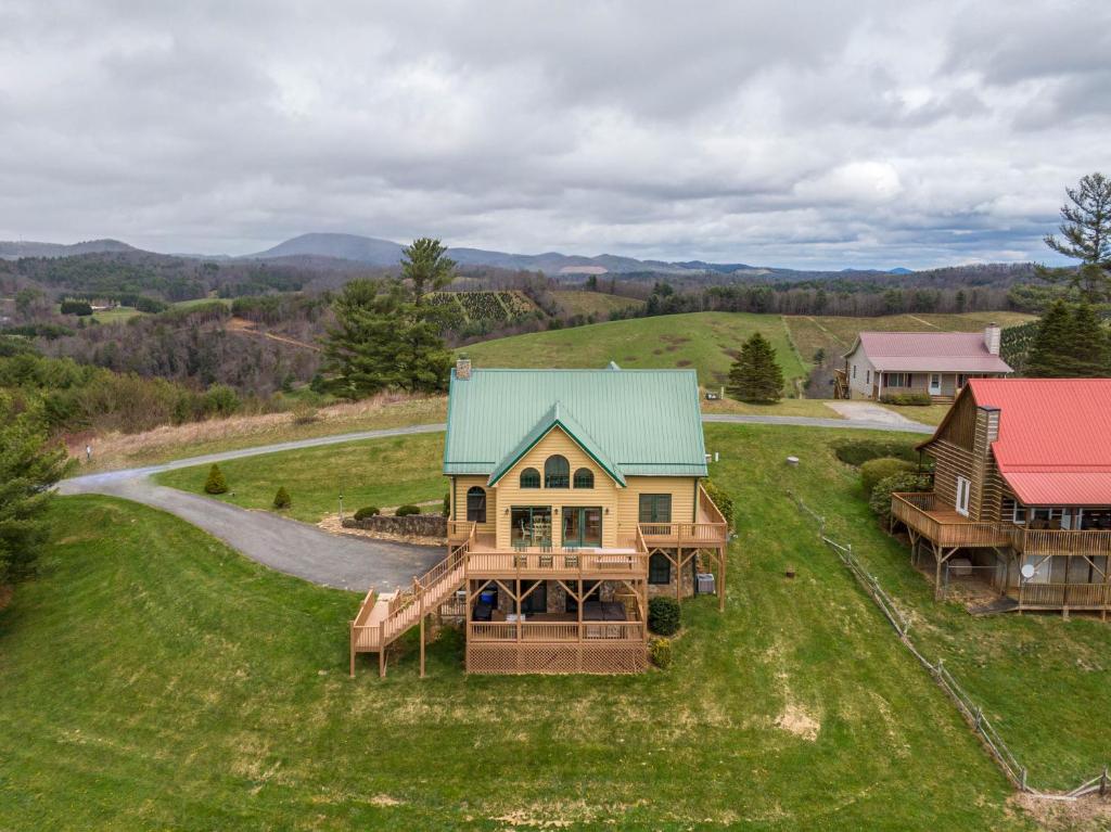 an aerial view of a house on a green field at Buena Vista in Todd
