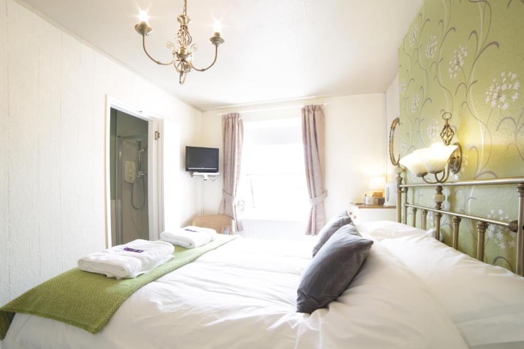 Postel nebo postele na pokoji v ubytování Sunrise Guest House
