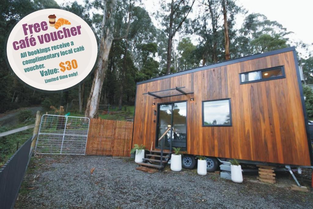 a tiny house is shown with a price tag at Kookaburra's Perch in Millgrove