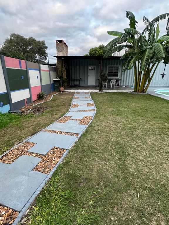 a walkway in front of a house at Quincho y hospedaje in Reconquista