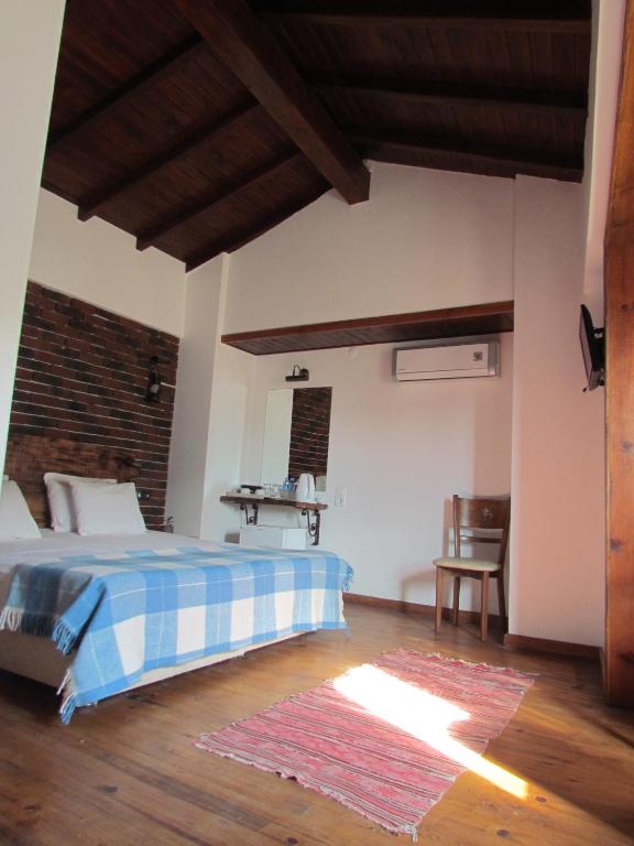 Postel nebo postele na pokoji v ubytování Amazon Petite Palace
