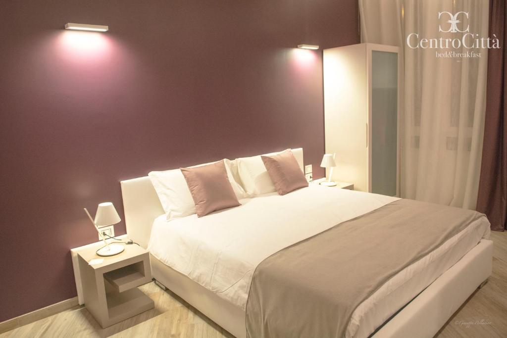 Postel nebo postele na pokoji v ubytování Centro Città Luxury B&B