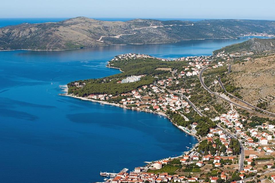 an aerial view of a town next to a body of water at Apartment & Room Angerona in Seget Vranjica