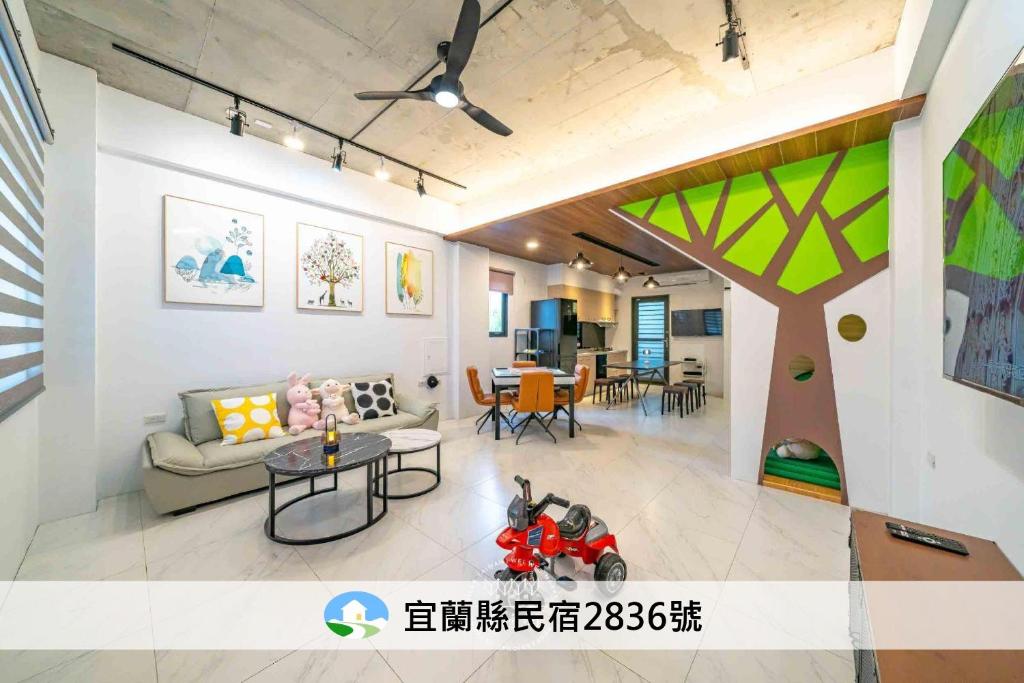 a living room with a couch and a table at 仰森水畔 in Jiaoxi
