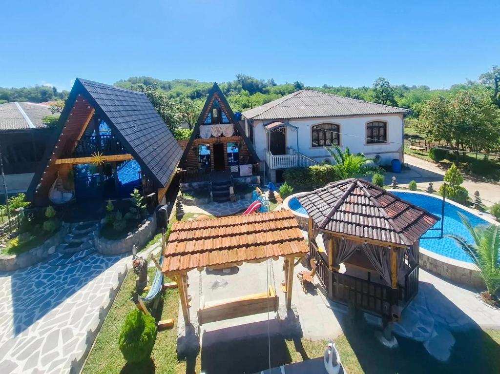 an aerial view of a house with a swimming pool at Sunny Cottage in Martvili