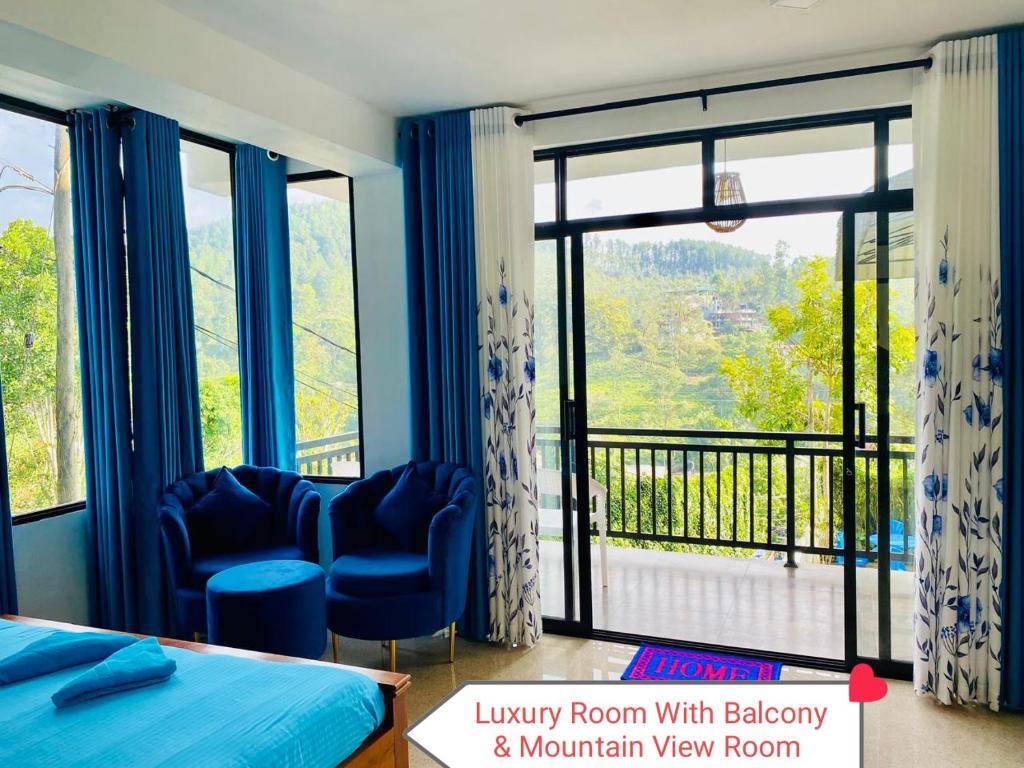 a bedroom with a bed and a view of a balcony at Rock Face Palace in Ella