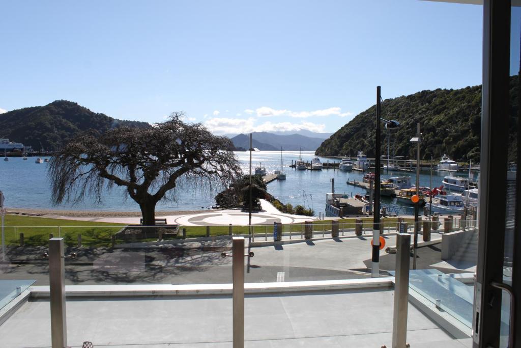 a view of a marina with boats in the water at Picton Waterfront Oxley's Luxury Apartment in Picton