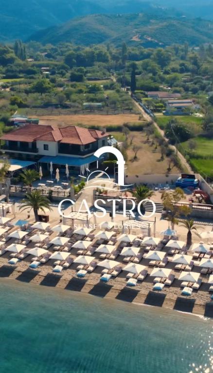 an aerial view of a resort with umbrellas and the ocean at Castro Sunset Stories in Neos Marmaras