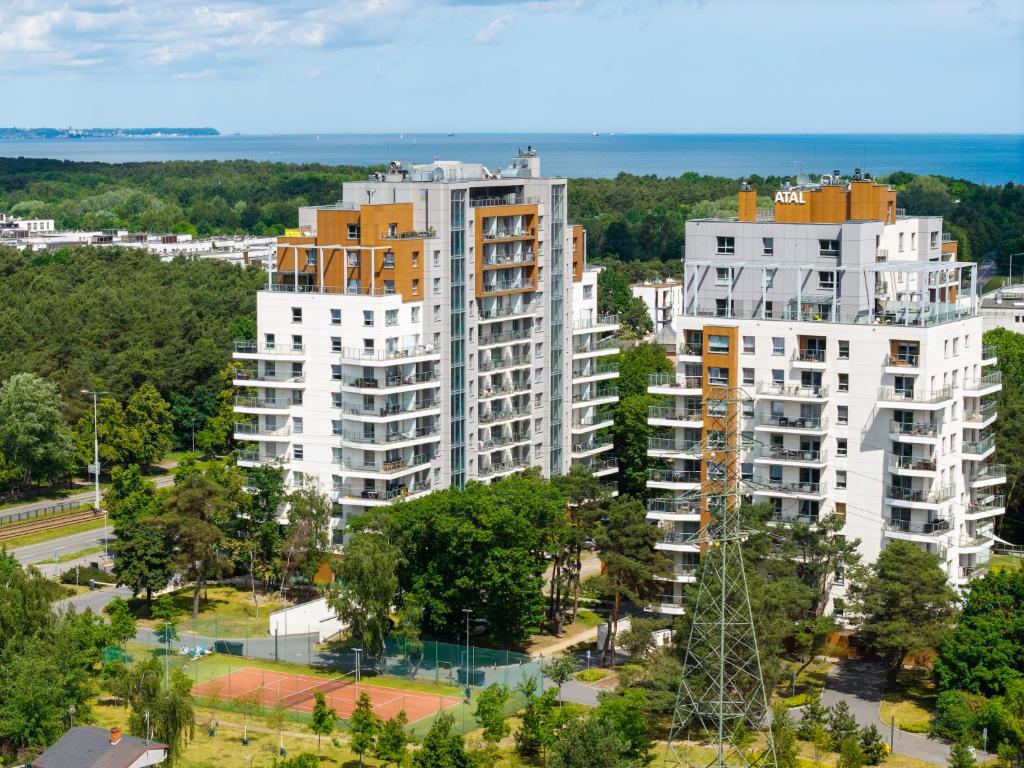 an aerial view of two tall white buildings at Symphony Baltica Towers Apartamenty by INA in Gdańsk