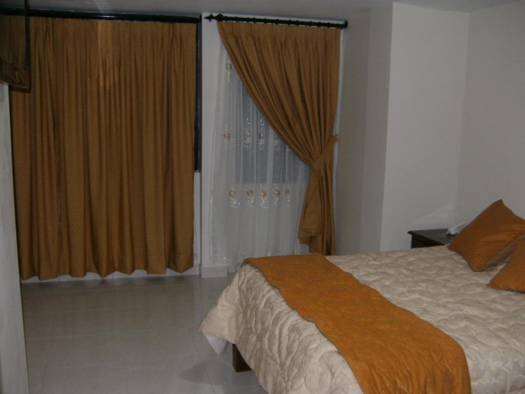 Postel nebo postele na pokoji v ubytování Hostal Fevilamir