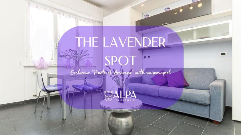 a purple living room with a purple couch and a table at "The Lavender Spot" con accesso alla spiaggia in Arenzano