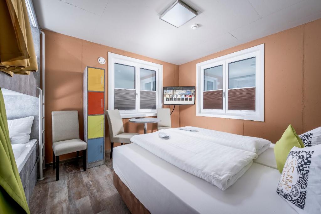 Posteľ alebo postele v izbe v ubytovaní Cubo Sport & Art Hotel