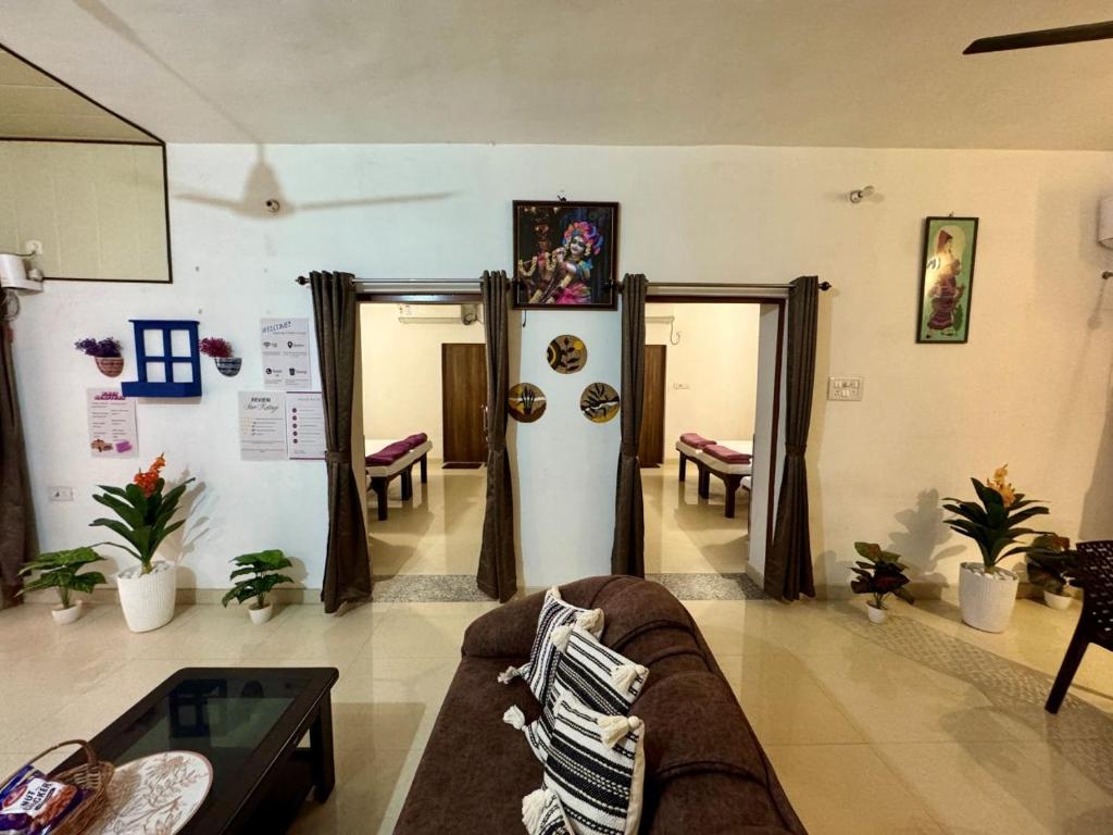 a living room with a couch and a table at Raahee Homestay in Varanasi