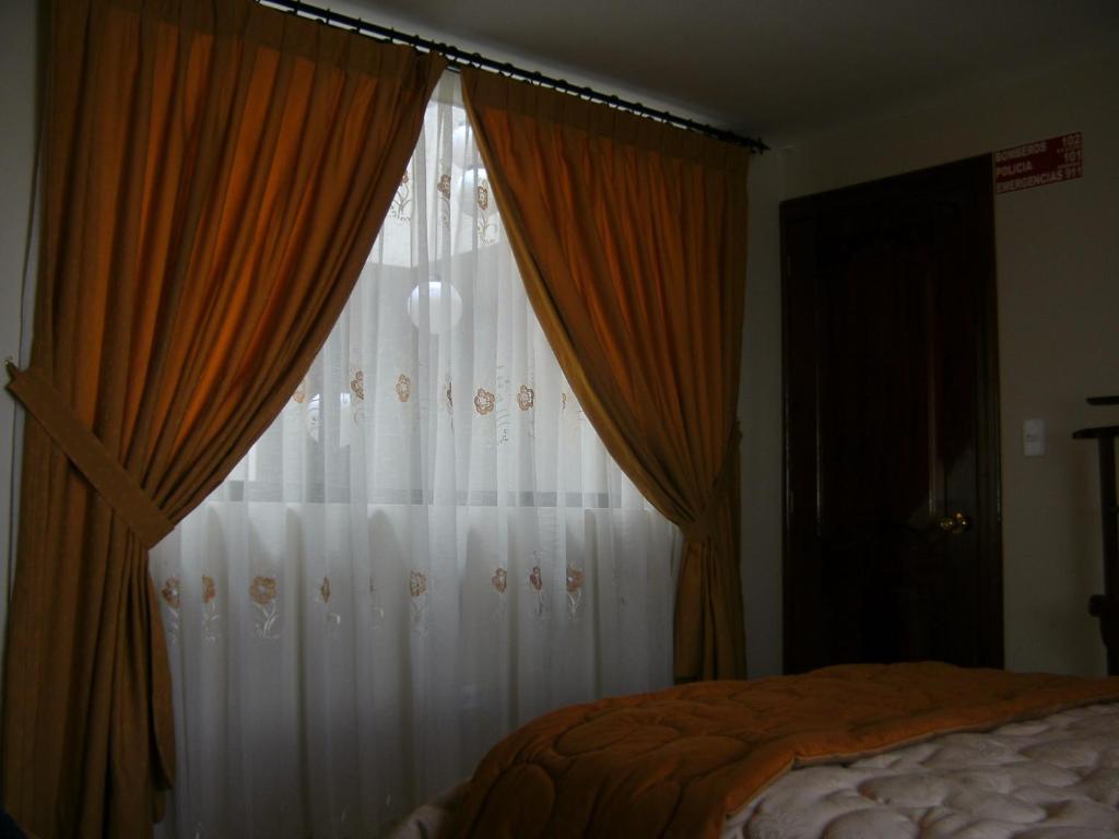 Postel nebo postele na pokoji v ubytování Hostal Fevilamir
