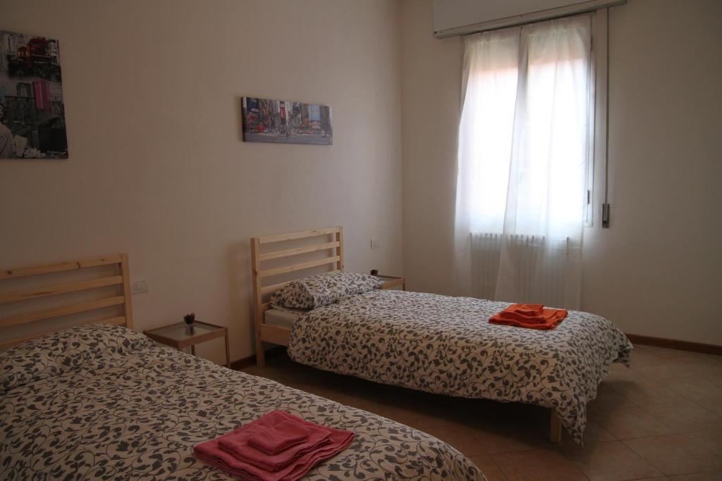 Posteľ alebo postele v izbe v ubytovaní Aduepassidallafiera