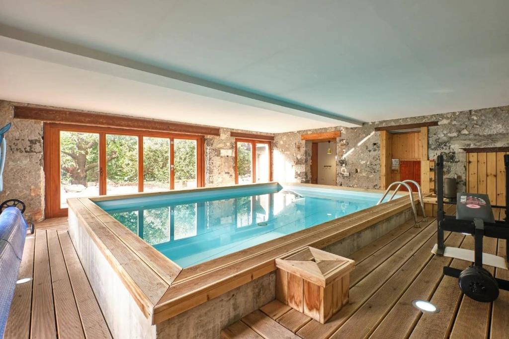 a large swimming pool in a house with at Chambre d'hôte l'Argentier in Noyarey