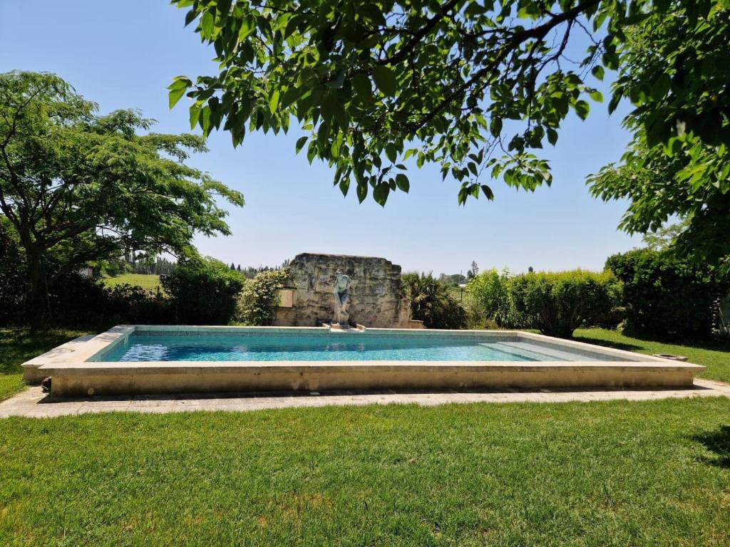a pool in the yard of a house at Victoria House pool garden in Fourques