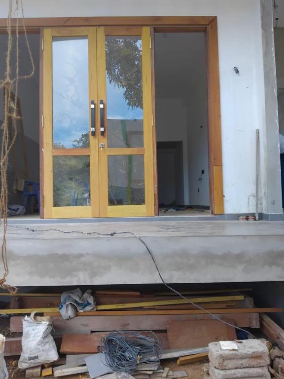 a house under construction with a door and windows at Monara Blue Beach in Dickwella