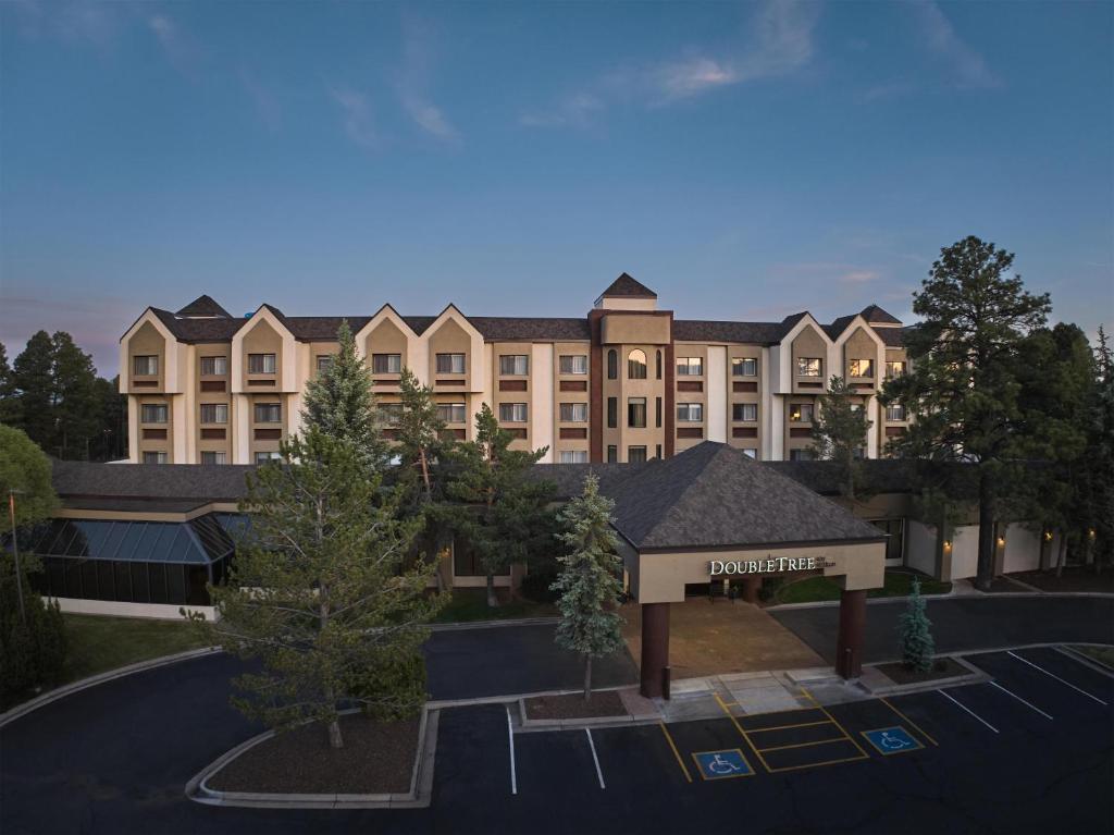 a rendering of a building with a parking lot at DoubleTree by Hilton Hotel Flagstaff in Flagstaff