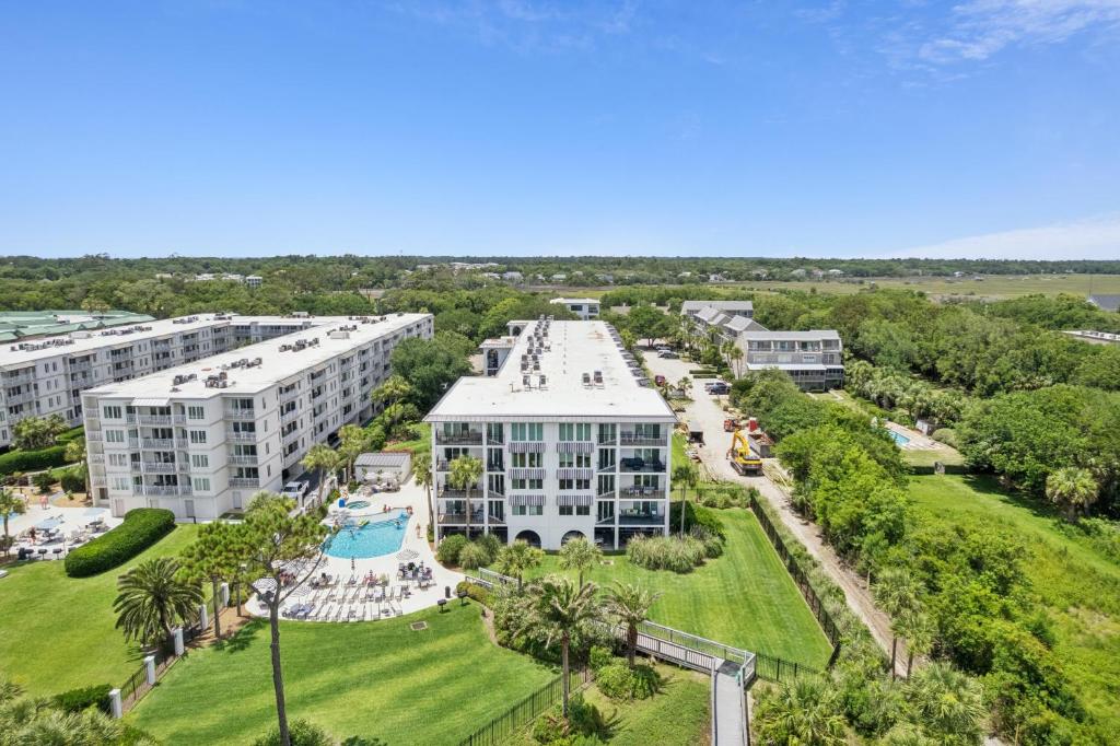 an aerial view of a resort with a large white building at North Breakers - Unit 202, Wood Ave in East End