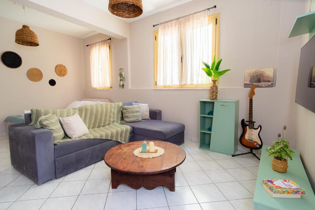 a living room with a couch and a table at Nesto Living in Chóra