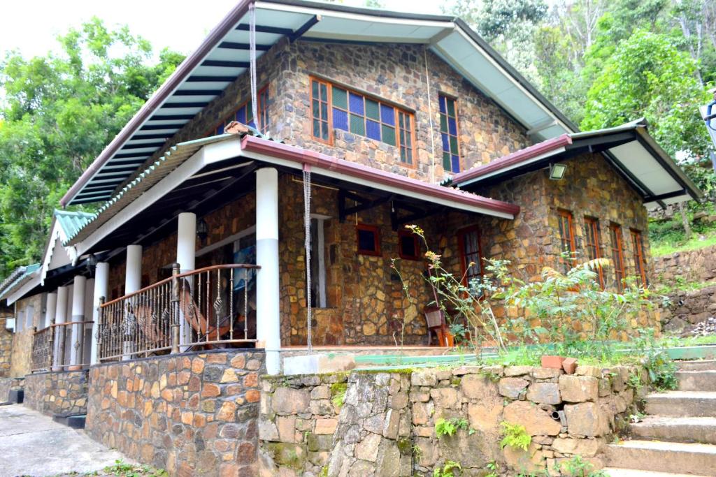 a stone house with stairs leading to it at Green Valley Holiday Resort in Haputale