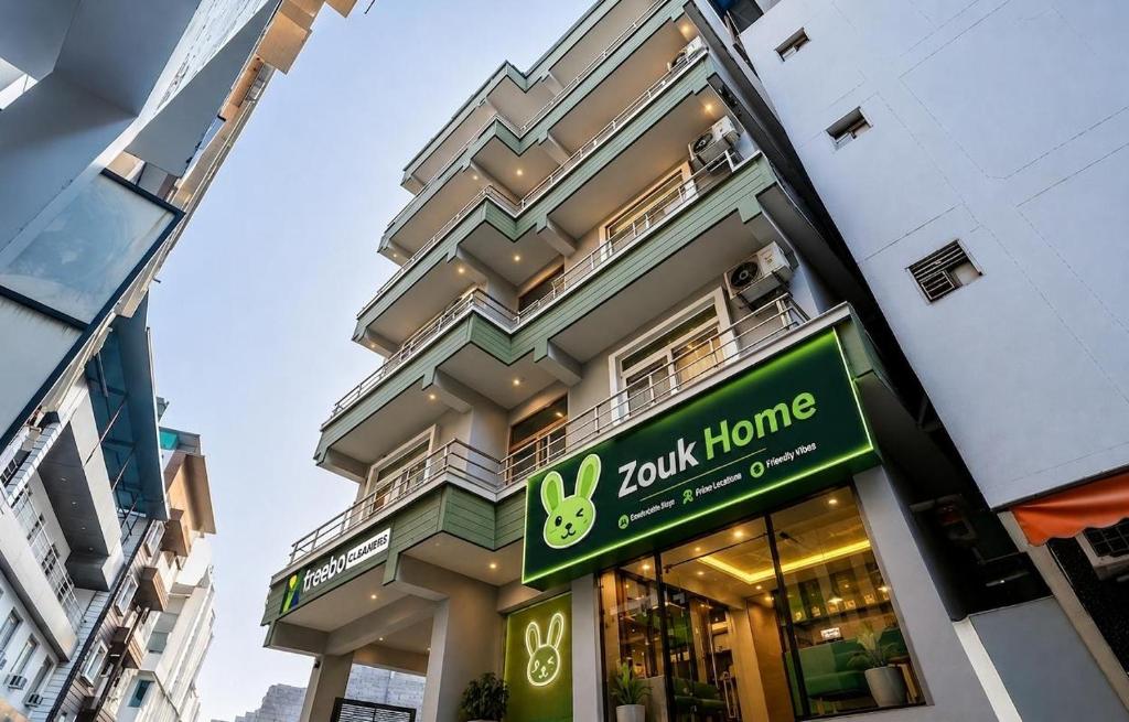 a store front of a building with a sign on it at Zouk Homes in Rishīkesh