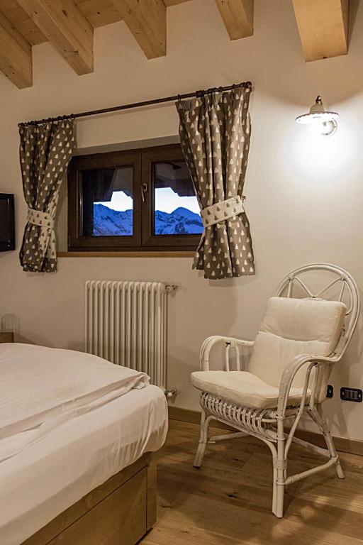 Postel nebo postele na pokoji v ubytování Residence Hotel K2