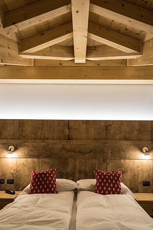 Postel nebo postele na pokoji v ubytování Residence Hotel K2