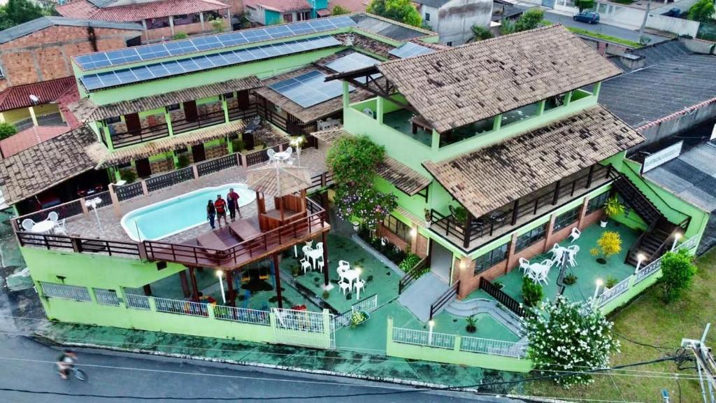 an overhead view of a house with a swimming pool at Pousada Campo Alegre Eireli in Itatiaia