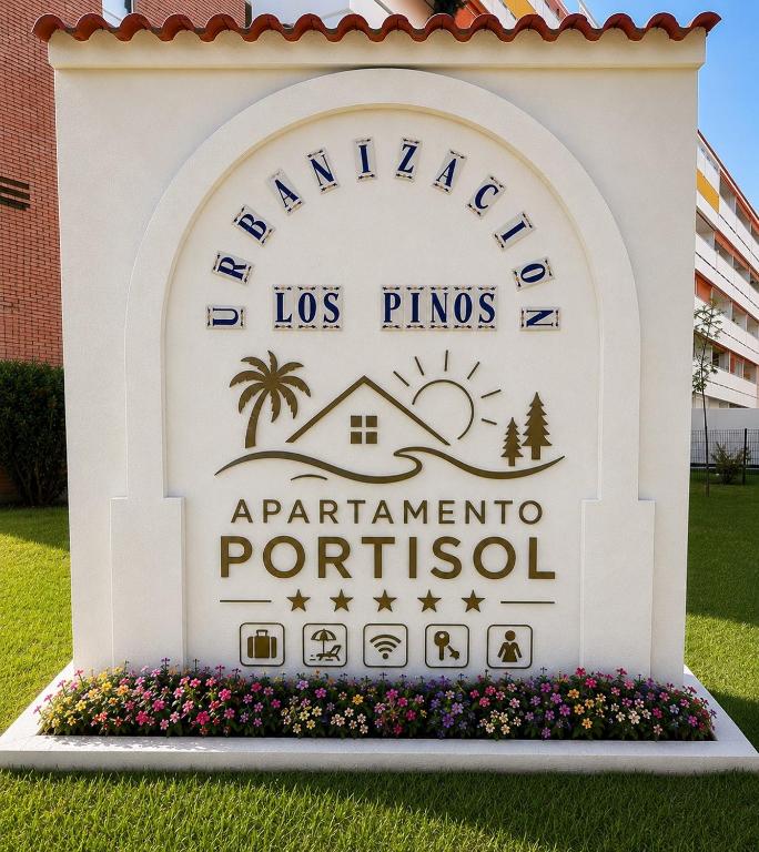 a sign for the las pines apartment portoster at Apartamento Portisol in El Portil