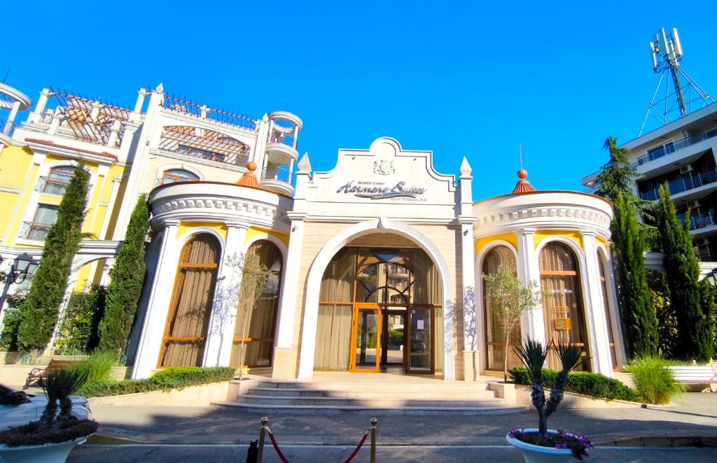 a large white building with a large entrance at Harmony Suites apartment 4 floor in Sunny Beach