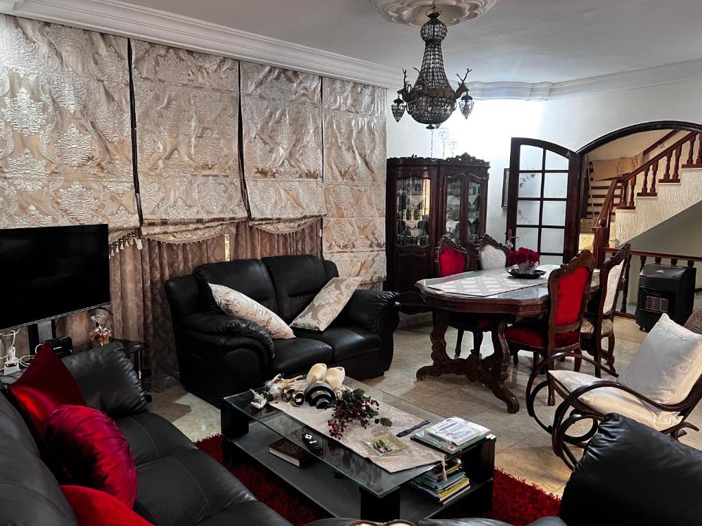 a living room with a couch and a table at Dar Cirta in Sicca Veneria
