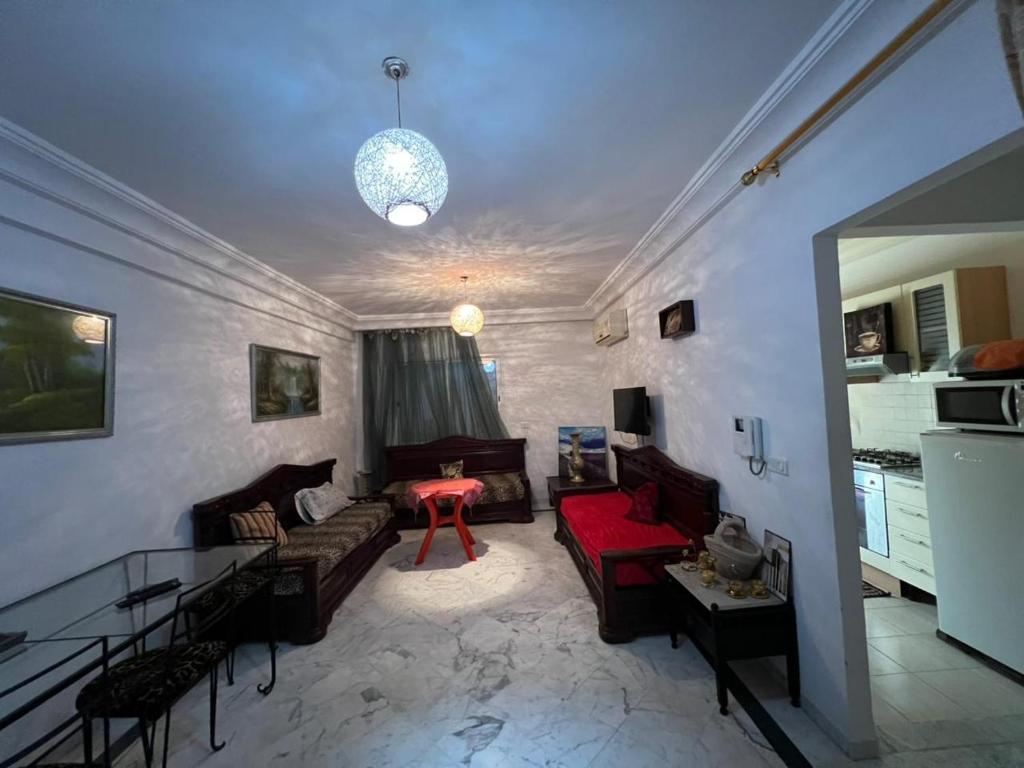 a living room with a couch and a table at dreams beach city in Sousse