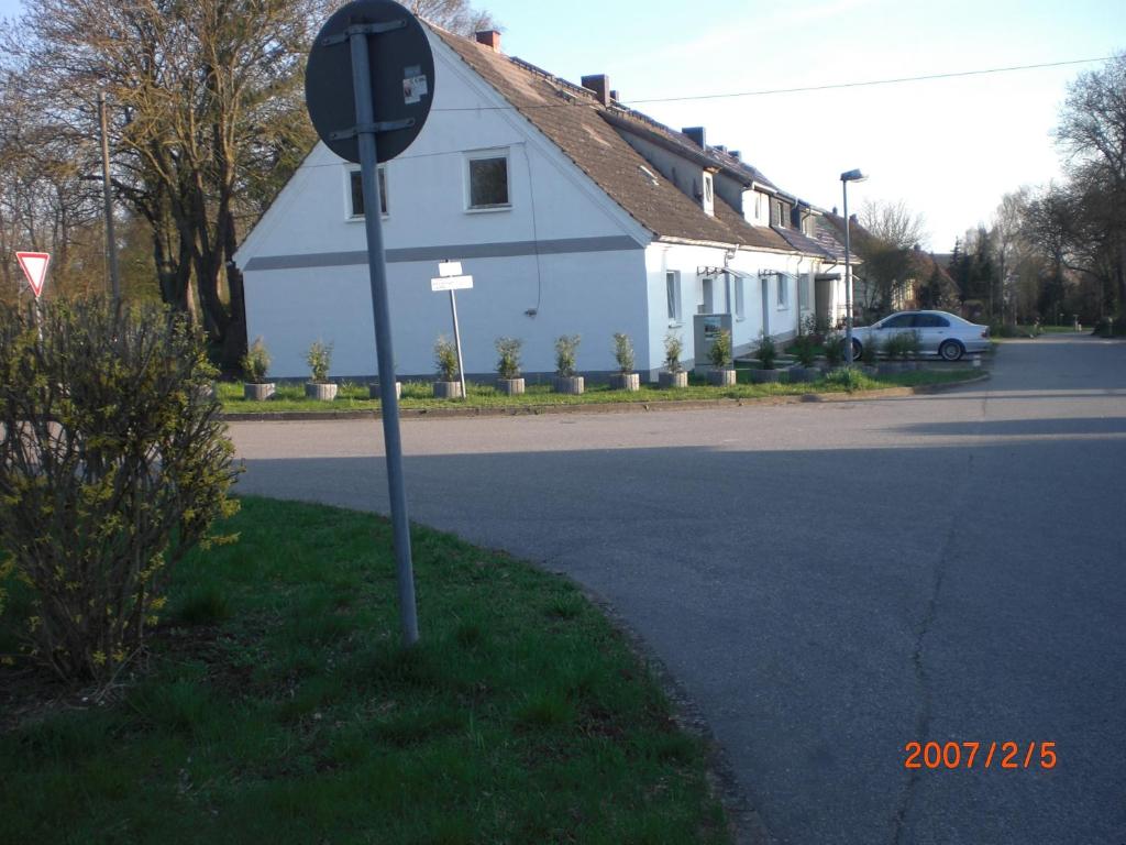 a stop sign on the side of a street at Gramelowersee in Teschendorf