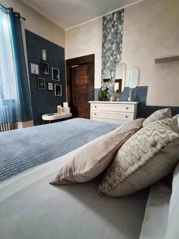a bedroom with a bed with two pillows on it at Dietro al Corso in LʼAquila