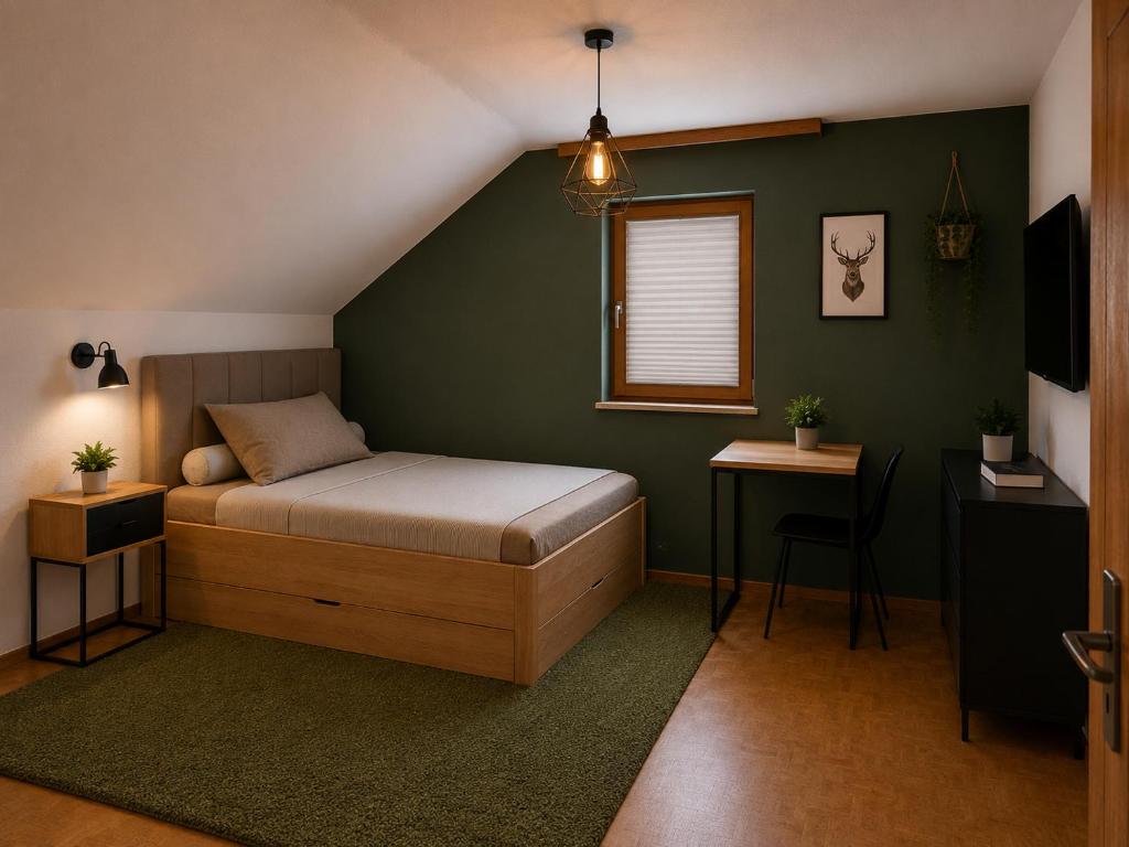a bedroom with a bed and a table and a window at Jagdhaus am Neubäuer See in Roding