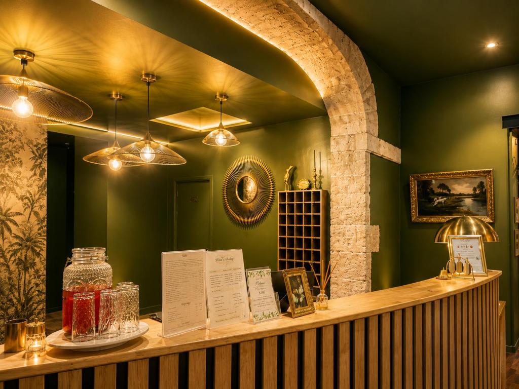 a shop with a counter with books and lights at Hôtel Abalone - Centre Gare in Nîmes