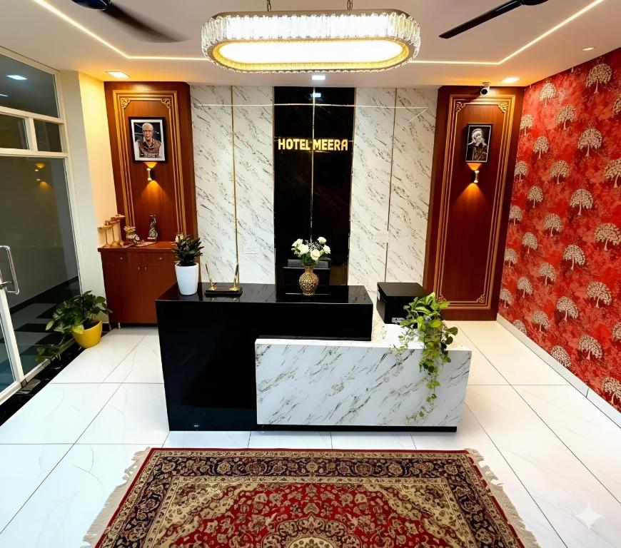 a lobby of a hotel with a reception desk at Hotel Meera in Bāwal