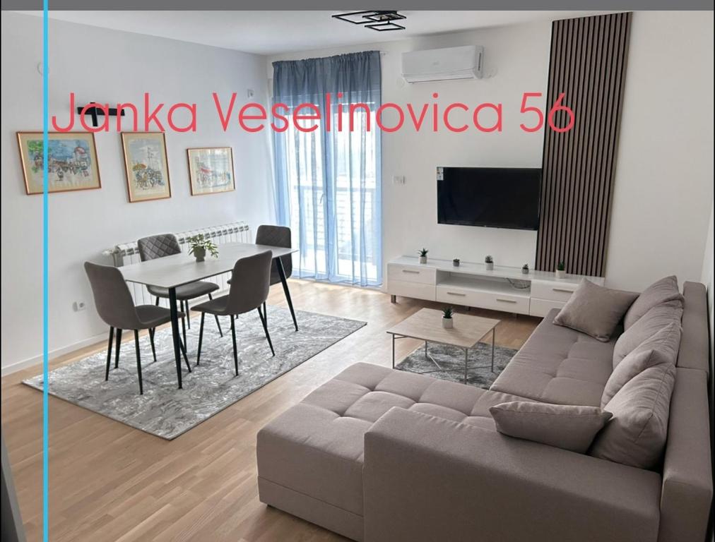 a living room with a couch and a table at Sabac City Apartman Centar S2 in Šabac