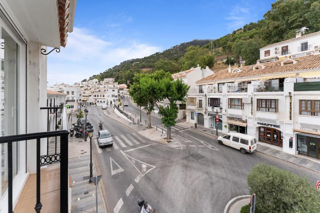 a view of a city street with cars on the road at Edf España Suites Mijas in Mijas