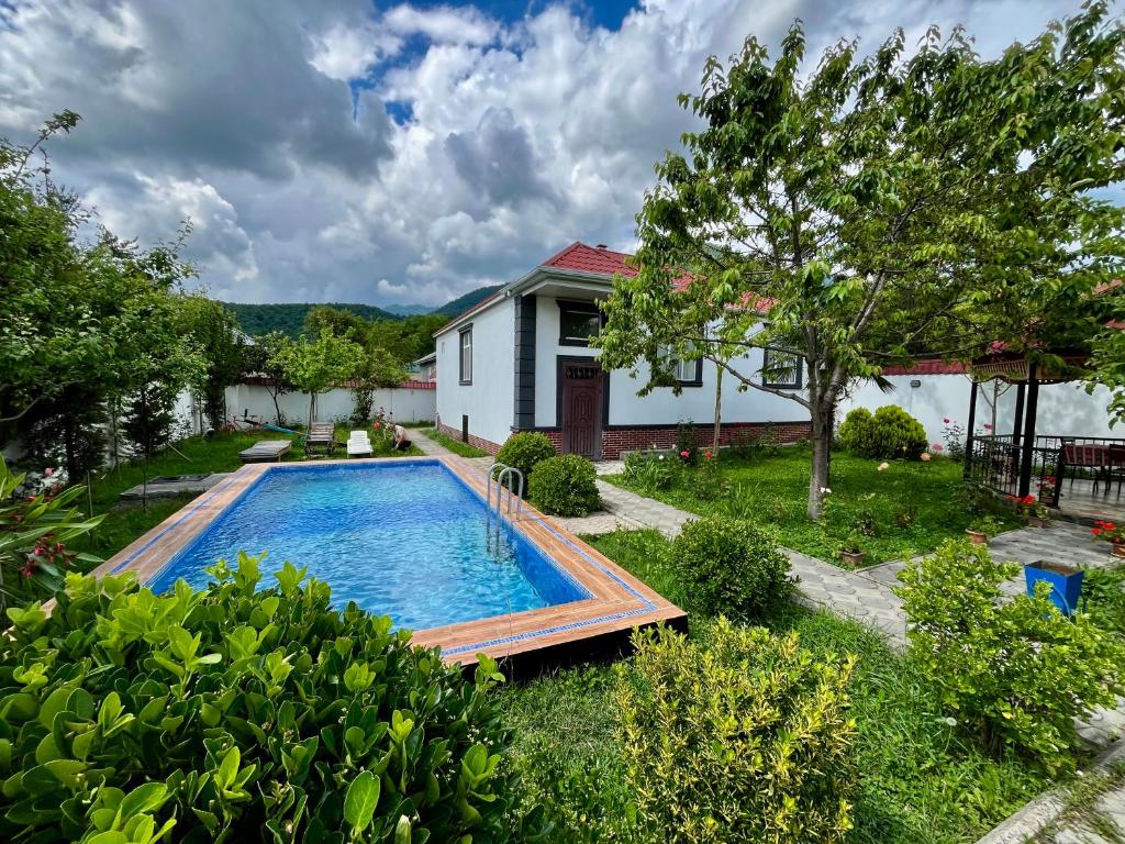 a swimming pool in the yard of a house at Gabala White House in Gabala
