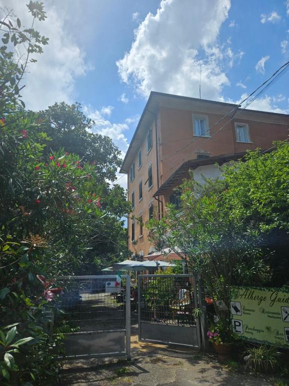 a building with a gate in front of it at Albergo Ristorante Guidi in Pistoia