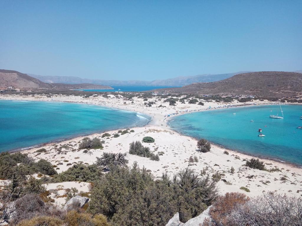 a view of a beach with boats in the water at La casa di lefki in Elafonisos