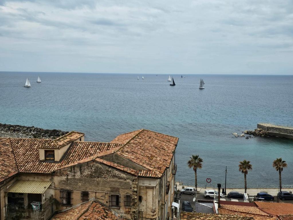 a view of a body of water with sail boats at Casa Janca Pizzo in Pizzo