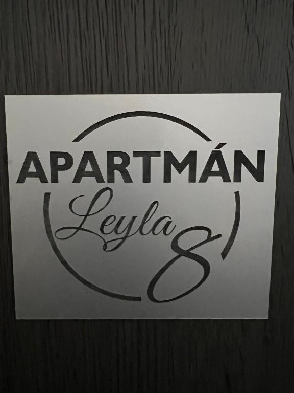 a sign on a wooden door that reads apartment leviota at Centrum Apartman LEYLA 8 in Bardejov