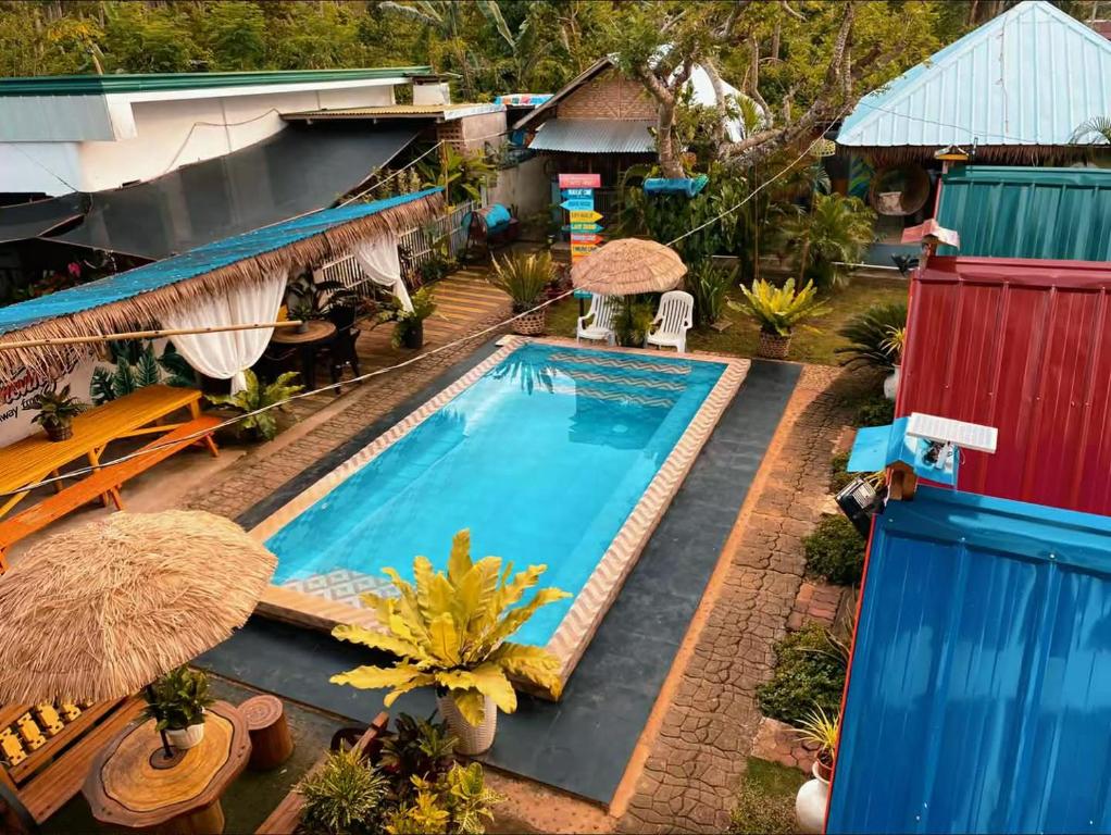 an overhead view of a swimming pool at a resort at La Provinzia Exclusive Use - 3 Air-Conditioned Rooms 3 Fan Cooled Huts Good for 12 People in Camotes Islands